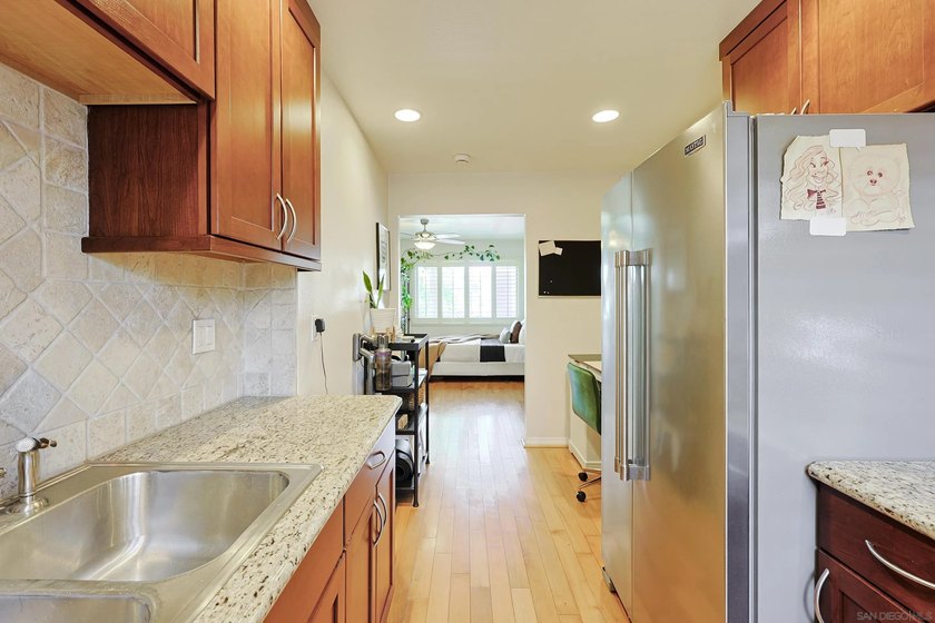 Welcome to this functional and stylish VA-approved studio condo - photo 6