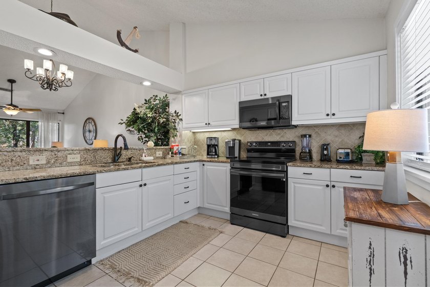 Welcome to this 2-bedroom, 2-bathroom condo in the prestigious - photo 4