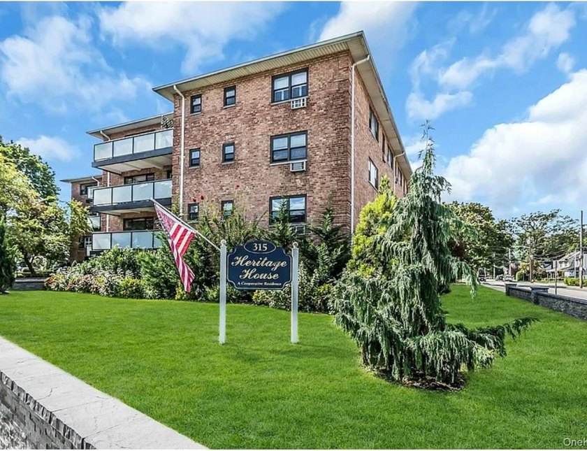 Welcome to Heritage House, Unit 1A with a front balcony! This - photo 22