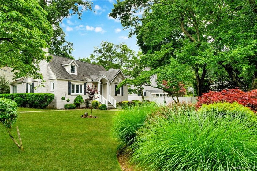 WELCOME HOME!! This charming brick Cape Cod with - photo 3