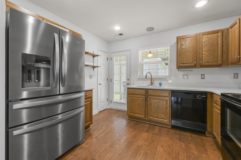 MUST SEE! This beautifully updated, single-level END UNIT - photo 6