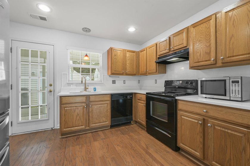 MUST SEE! This beautifully updated, single-level END UNIT - photo 7