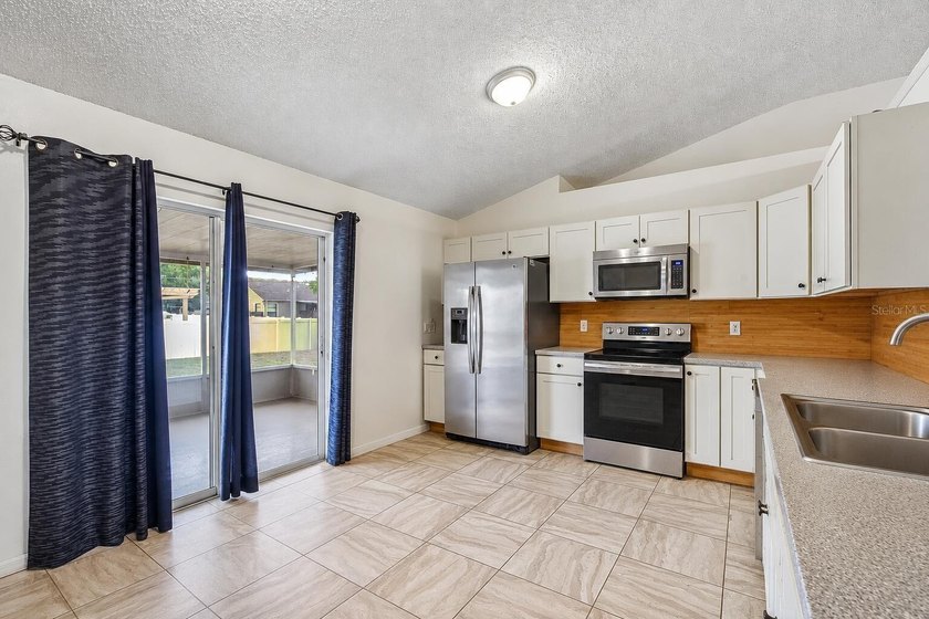 Welcome to this beautifully maintained Palm Bay home blending - photo 8