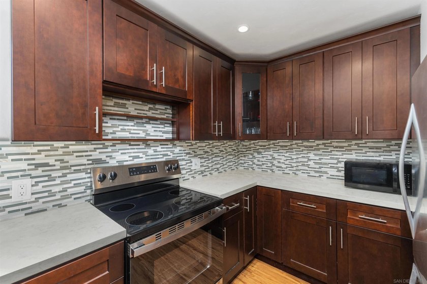 Welcome to this beautifully appointed top-floor residence in the - photo 9