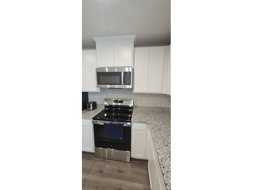 Sold Fully Furnish! Welcome to coastal living at its finest in - photo 13