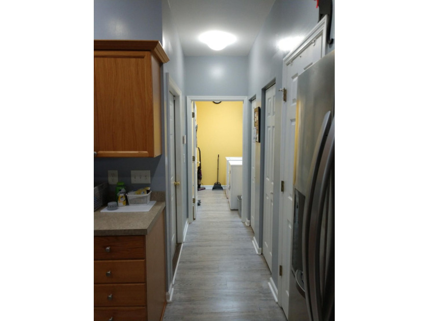 One floor ranch villa. Maintenance free living. @/2 bath wood - photo 9