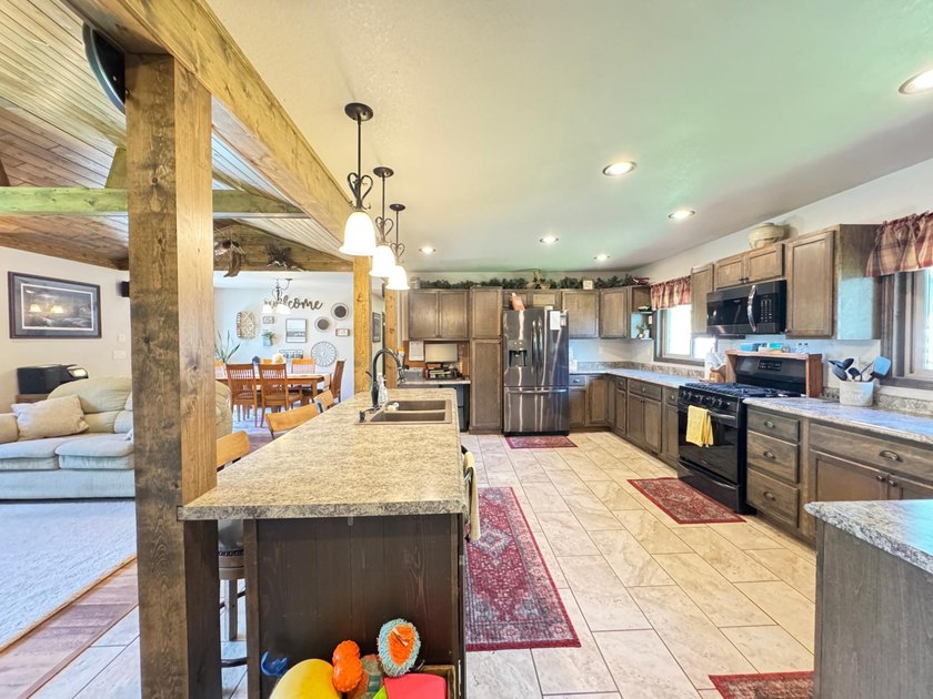 Move right into this waterfront home on the Rhinelander flowage - photo 3