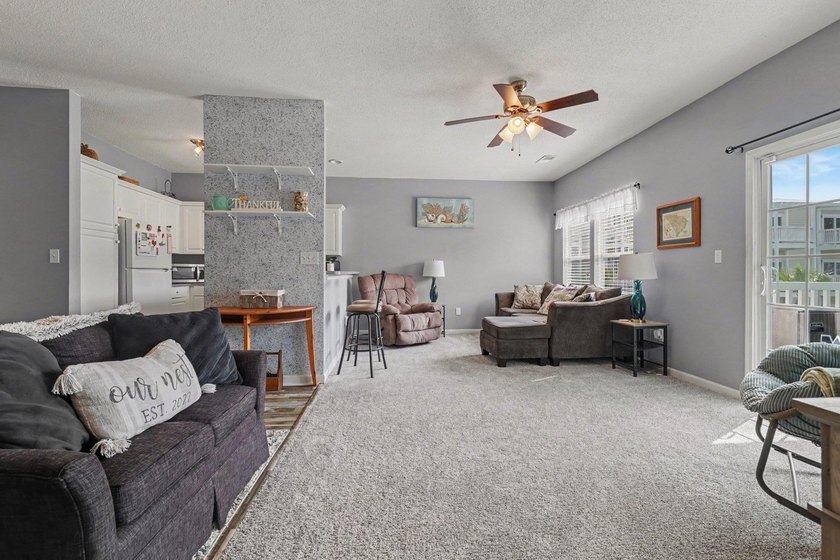 This updated second-floor, 3-bedroom, 2-bath condo overlooks the - photo 3