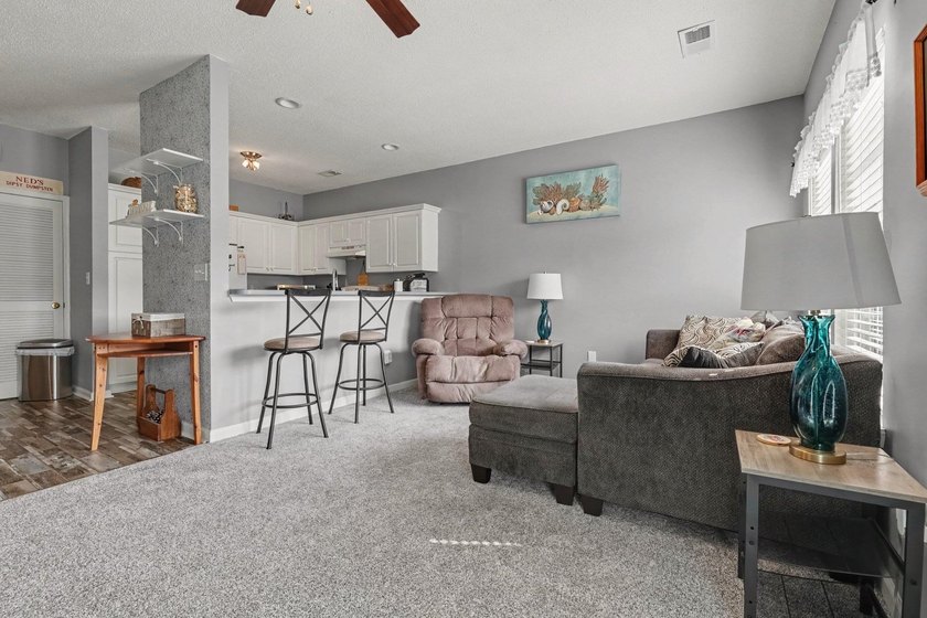 This updated second-floor, 3-bedroom, 2-bath condo overlooks the - photo 5