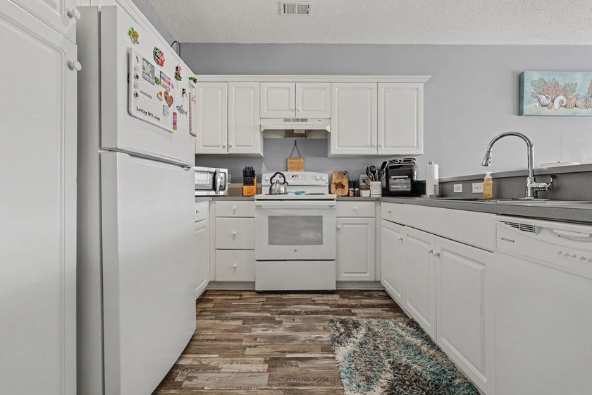This updated second-floor, 3-bedroom, 2-bath condo overlooks the - photo 9