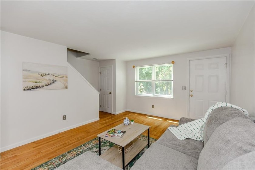 Step into this welcoming townhouse style unit located in - photo 3