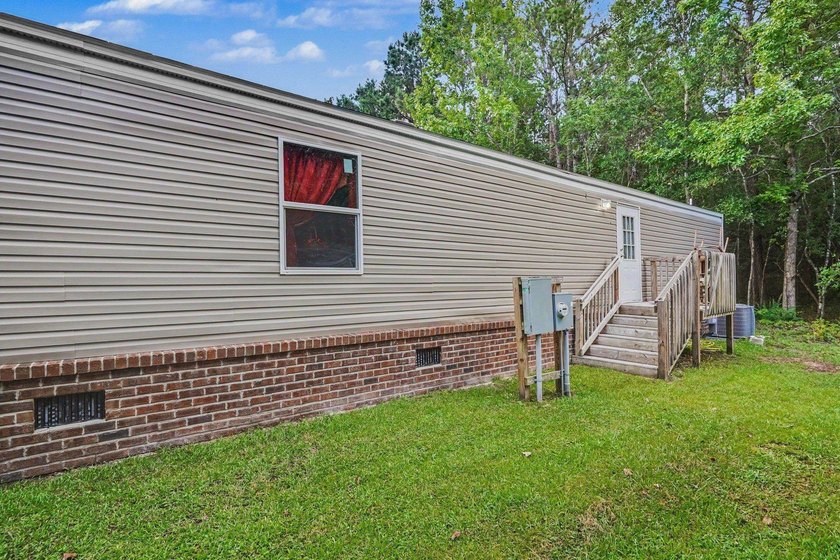 Affordable coastal living awaits in Baywood Estates! Located in - photo 3