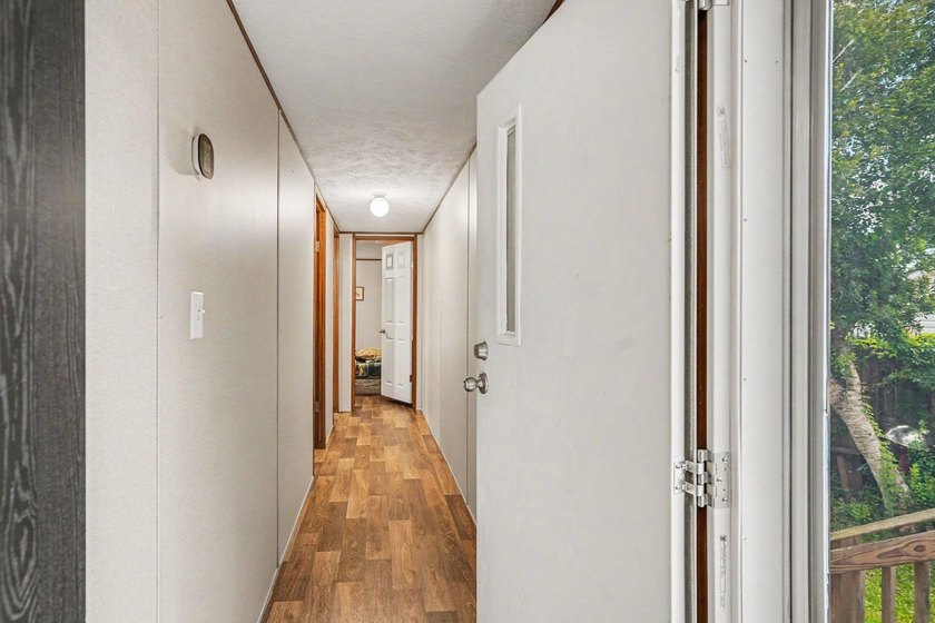 Affordable coastal living awaits in Baywood Estates! Located in - photo 4