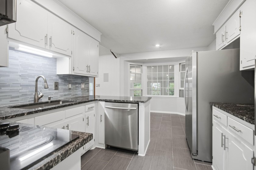 Situated on a spacious corner lot surrounded by mature trees - photo 7