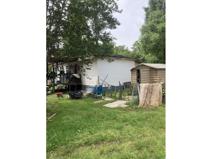 Tucked away on approximately 1 acre, this versatile manufactured - photo 4