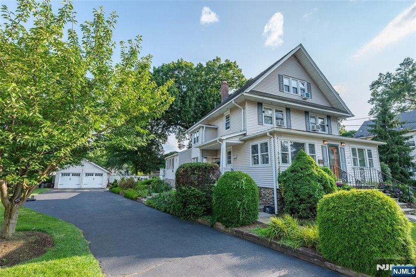 This income-producing two-family home lies in the heart of - photo 2