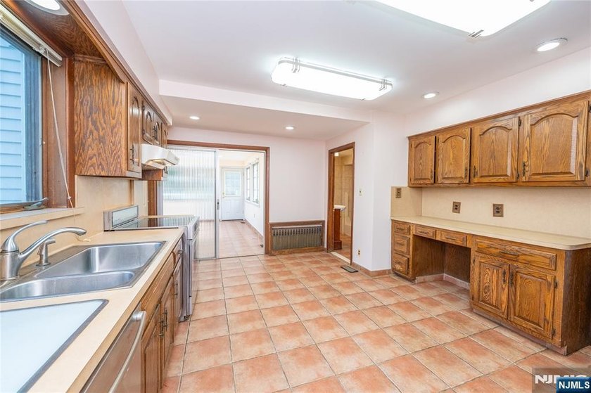 This income-producing two-family home lies in the heart of - photo 7