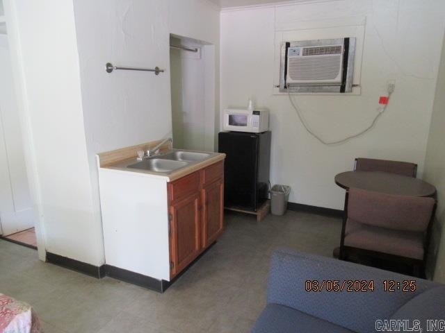 This is currently operating as a motel, but more so as a - photo 9