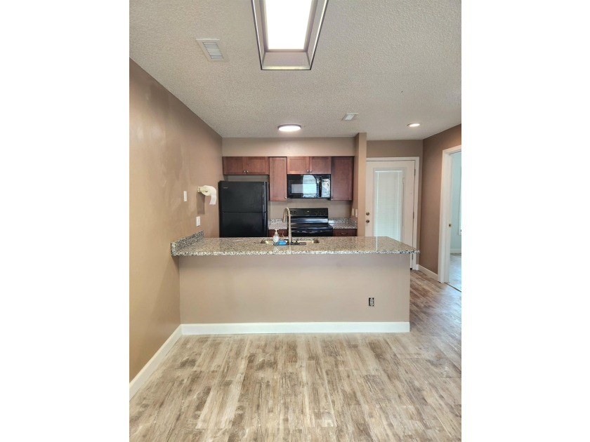 Rarely available, this beautifully updated third-floor condo - photo 5