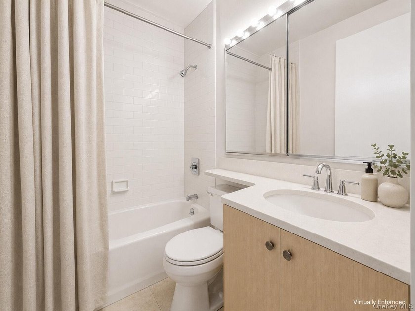 Perched on the 20th floor of a full-service Upper East Side - photo 9