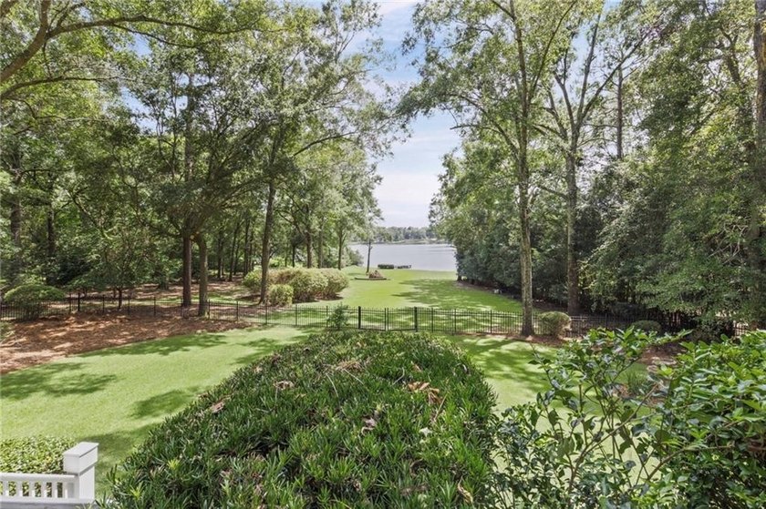 Private gated entrance, 4 sprawling acres, and 108 feet of lake - photo 32