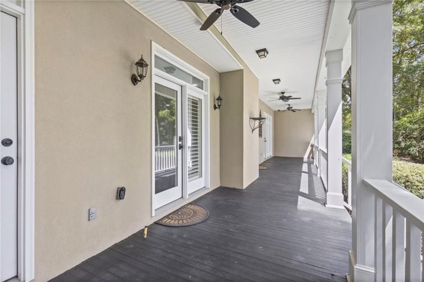 Private gated entrance, 4 sprawling acres, and 108 feet of lake - photo 33