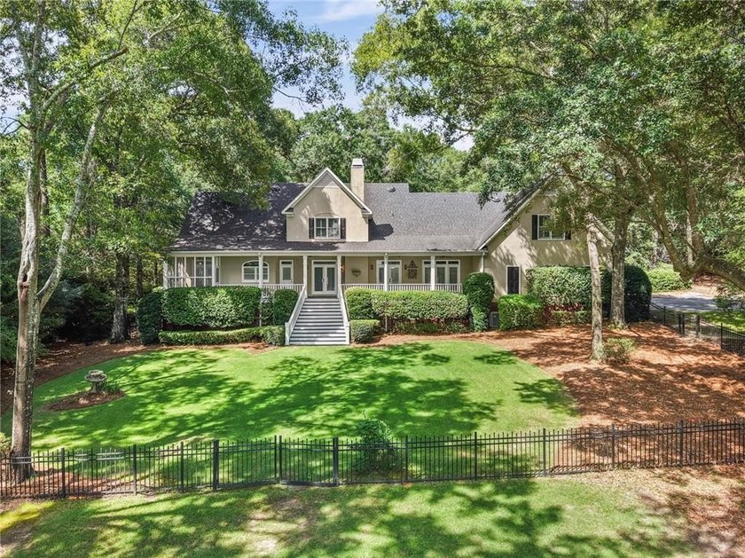 Private gated entrance, 4 sprawling acres, and 108 feet of lake - photo 35