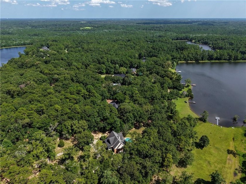Private gated entrance, 4 sprawling acres, and 108 feet of lake - photo 40