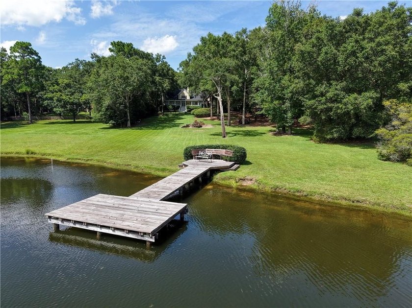 Private gated entrance, 4 sprawling acres, and 108 feet of lake - photo 43
