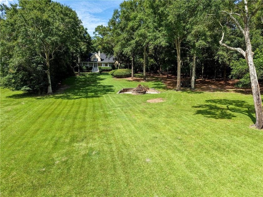 Private gated entrance, 4 sprawling acres, and 108 feet of lake - photo 44