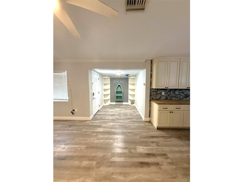 Short Sale. This LARGE 4/2/2 pool home sits on a peaceful - photo 3