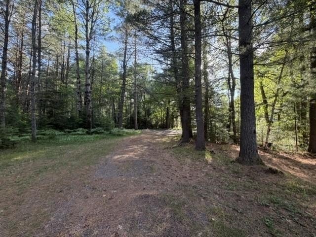 Tucked away on .68 wooded acres, this 2-bedroom 2-bath raised - photo 3
