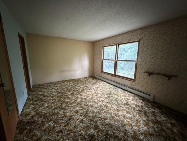 Tucked away on .68 wooded acres, this 2-bedroom 2-bath raised - photo 9