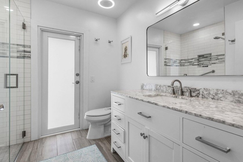 Stunning, fully renovated 4 BD, 2.5 BA residence situated on an - photo 18