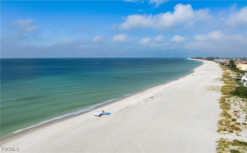 Experience true beachfront living in this stunning corner-unit - photo 3