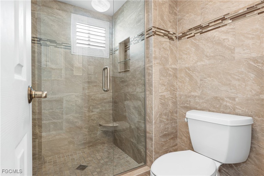 Experience true beachfront living in this stunning corner-unit - photo 8