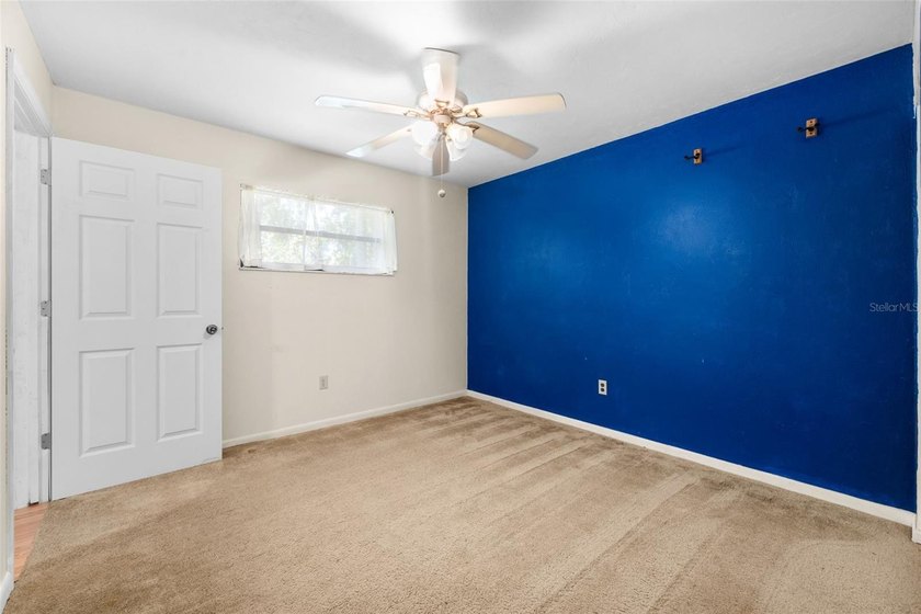 Welcome to your new home! Nestled on a spacious half-acre lot in - photo 12