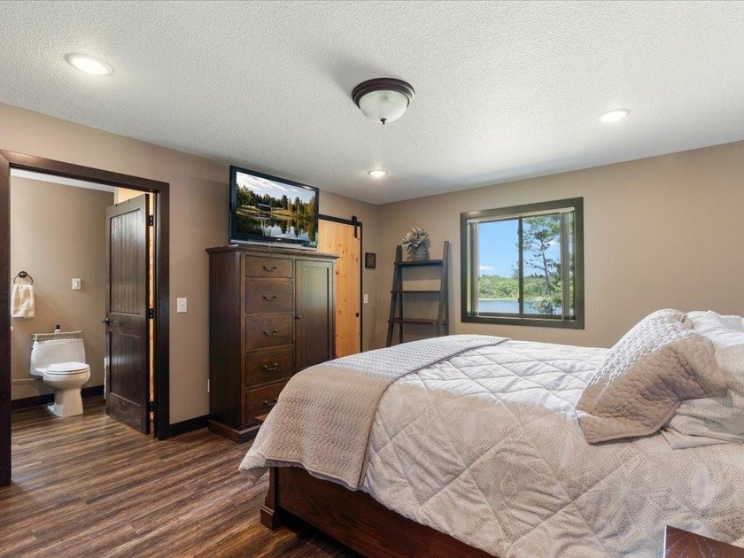 LAKE BELLE TAINE! Rare offering alert on one of the region's - photo 26