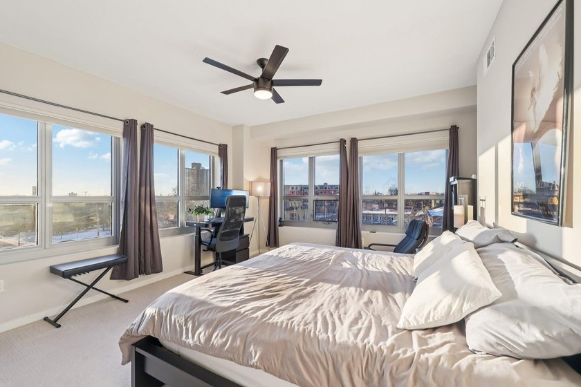 This Skyscape single-level end-unit condo offers the privacy and - photo 15