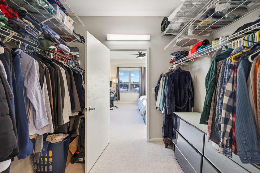 This Skyscape single-level end-unit condo offers the privacy and - photo 20
