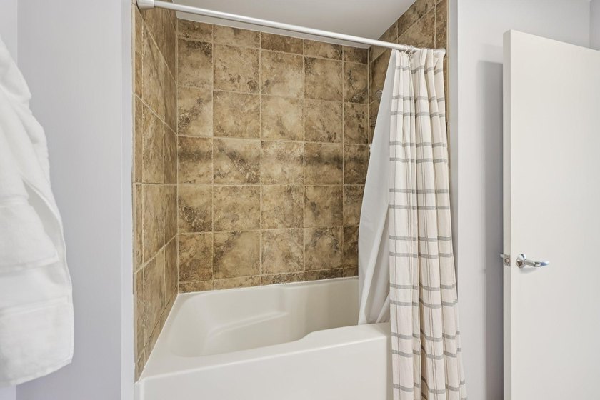 This Skyscape single-level end-unit condo offers the privacy and - photo 21