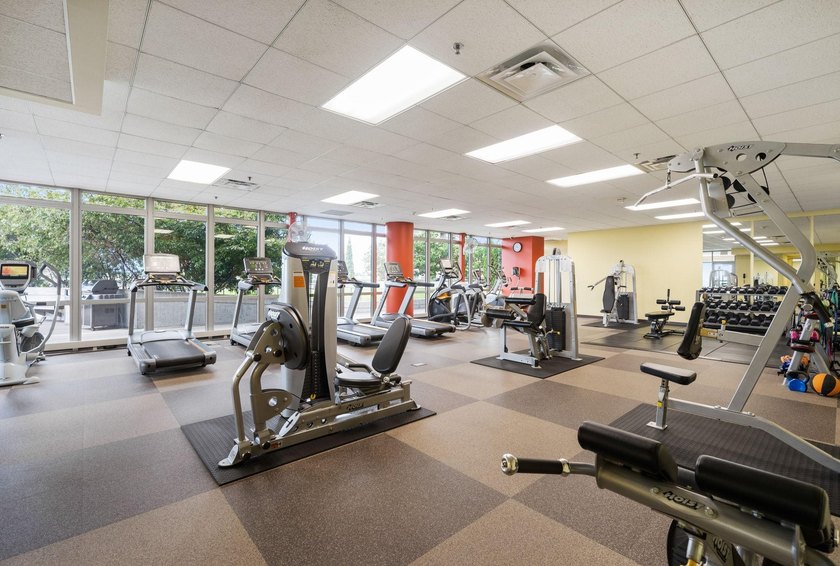 This Skyscape single-level end-unit condo offers the privacy and - photo 26