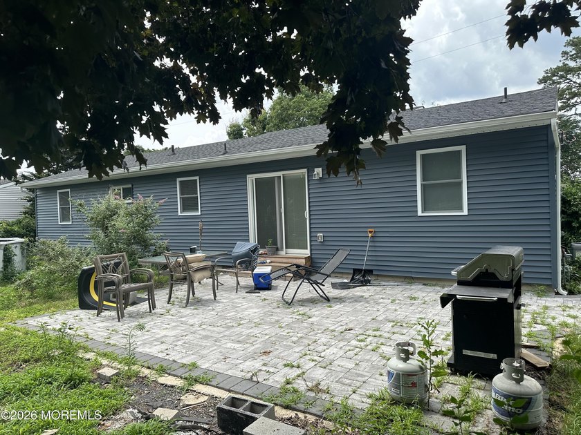 Totally renovated 2023. Open kitchen/living room floor plan with - photo 18