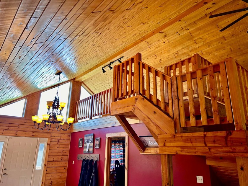 Your Northwoods dream home awaits! Nestled on 14.68 acres, this - photo 7
