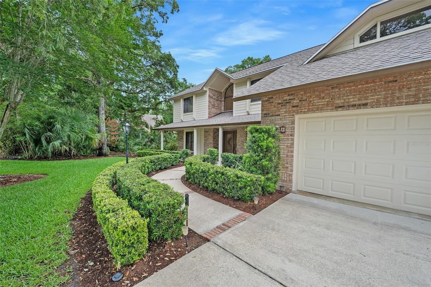 Custom-Built Brick Beauty in Breakaway Trails! Tucked away on a - photo 3