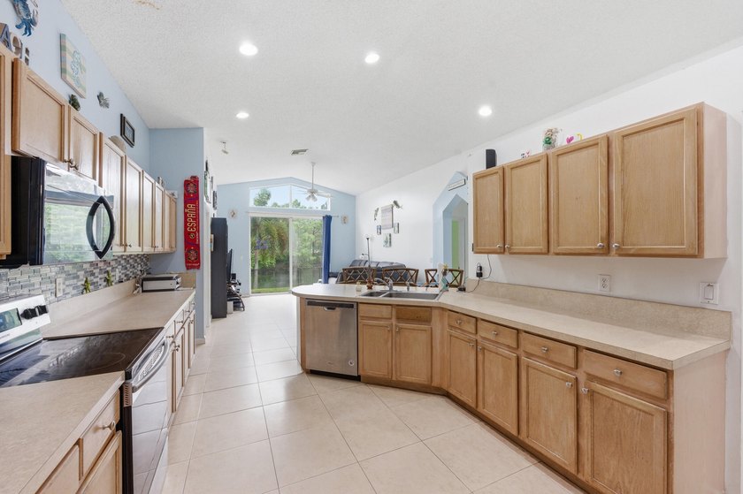 Spacious home with high ceilings and a bright, open layout. The - photo 5