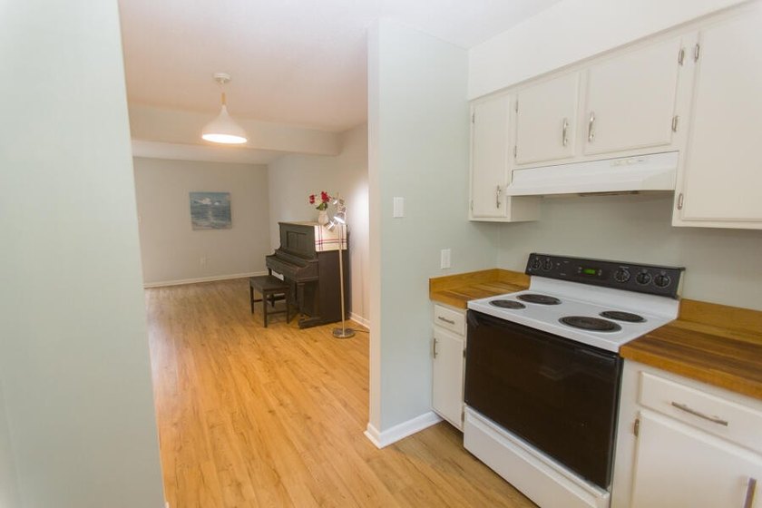 Cute and comfy. Downstairs has Living/Dining and patio . Kitchen - photo 4