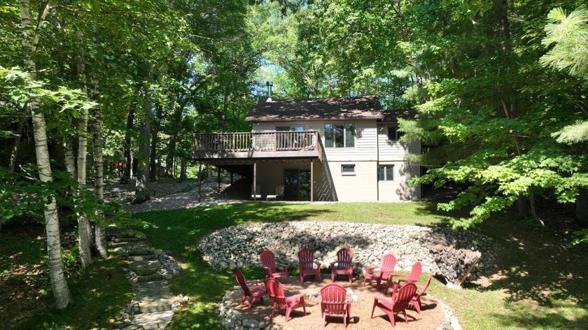 BIRD LAKE CHARMER. Tucked in the woods, this year-round home - photo 3