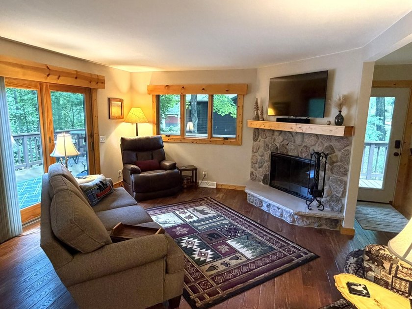 BIRD LAKE CHARMER. Tucked in the woods, this year-round home - photo 7