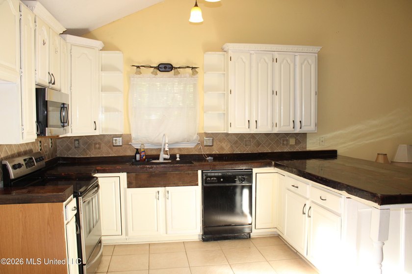 This home features an open floor plan, lots of shade from the - photo 17